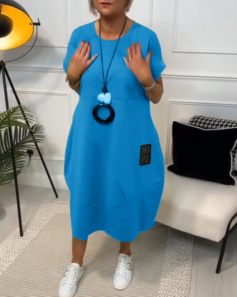 NIPPON™| ブラックの半袖ドレス、「HOPE」モチーフ付き